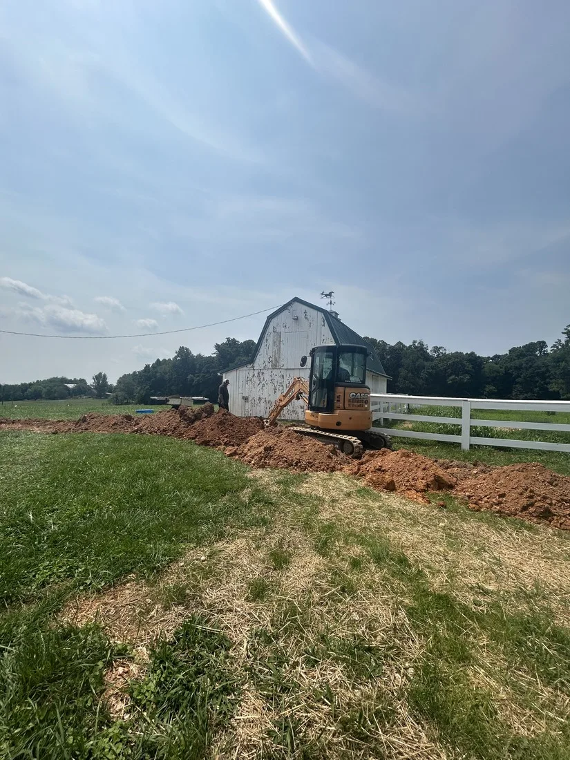 HydroWells excavator at an old farm property well site